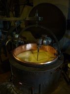 mixer in brass bowl, cheese production