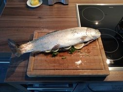 raw fish on a wooden board