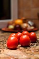 small red tomatoes on the table