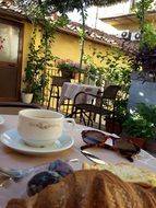 cup of coffee and fresh bread on a table in a restaurant in Italy