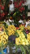 fruits and berries on market stall