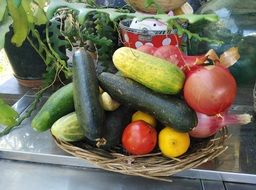 cucumber tomato lemon onion on plate