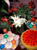 easter cake, dessert and tulips on the table