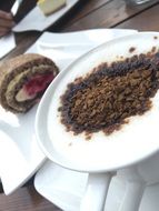 coffee and cake on table in cafe