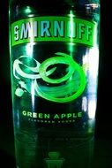 bottle of vodka with a green apple