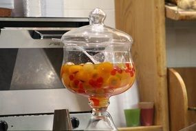 Glass vase in the kitchen with the yellow liquid