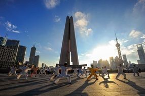 group of people training outside in china