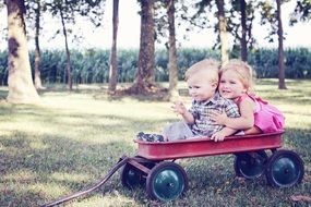 children in a metal trolley