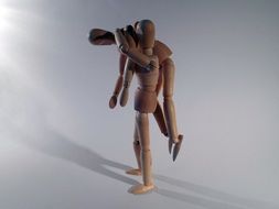 two wooden dolls