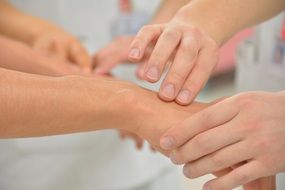 checking pulse hand