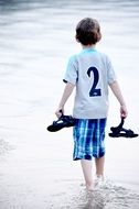 walking boy child in the water