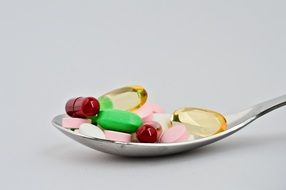 red green pink drugs on spoon