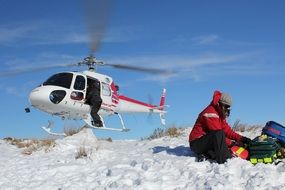 helicopter and lifeguard on the snow