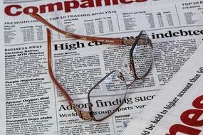 newspaper and glasses