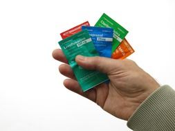 packing pills in human hands