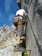 photo of the climbing on a stone wall