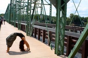 girl exercising on the bridge