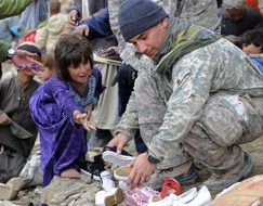 soldier help child