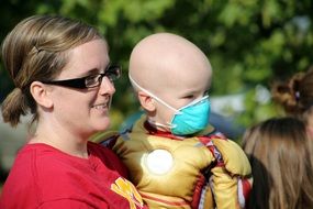 mother with boy in face mask cancer family