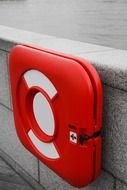 lifebuoy on a stone wall