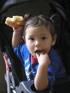 little girl eating a donut