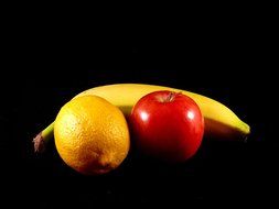 fruits healthy food apple lemon banana black background