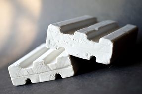 Two pieces of white curd soap