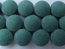 green pills on the table