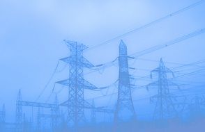 power masts and lines in mist