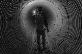 Black and white photo of the man in the tunnel