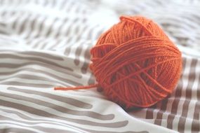 Orange wool ball for knitting