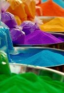 barrels with colorful powder for traditional jewelry in india