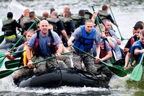 training boat teamwork with paddles