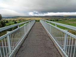 beautiful pedestrian bridge with white railings