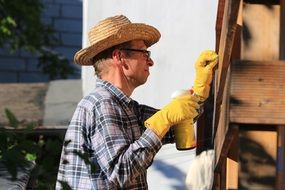 a man repairs a house