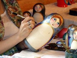 girl with nesting doll in Russia