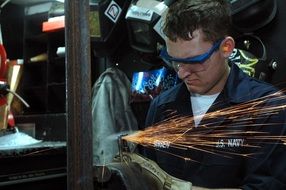 worker with glasses when grinding