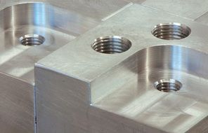 threaded holes in the metal part