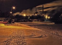 snowy night lake in finland