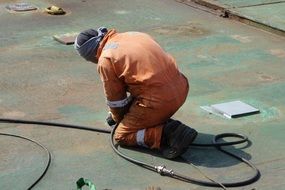 uniformed welder at work