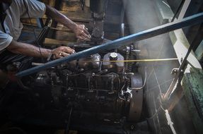 man at boat engine