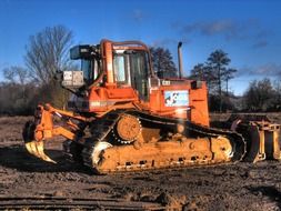 excavator with blades