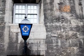 blue lights with a sign police in Ireland
