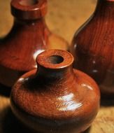 three wooden vases