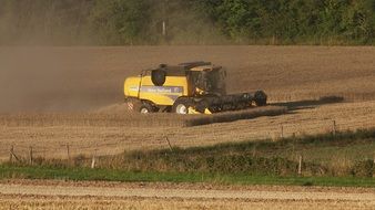 landscape of the machine on a field among the plants