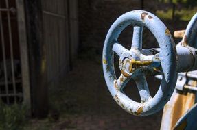 rusty blue wheel in a factory