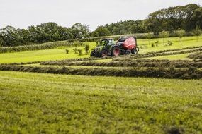 agriculture tractor on green field
