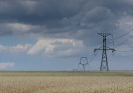 High transmission towers on a meadow