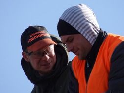 two workers against the sky
