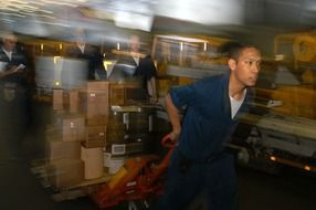 worker on the aircraft carrier "kitty hawk"
